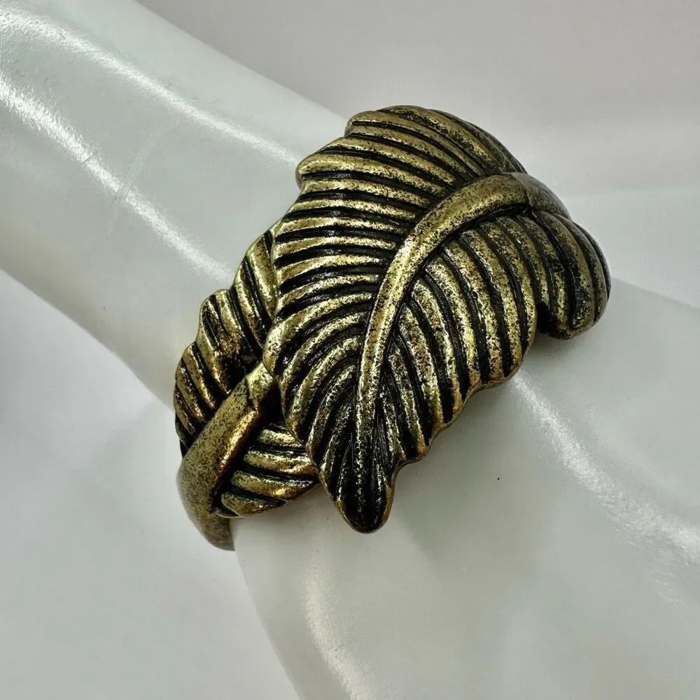 Brass tone leaf clamper bracelet